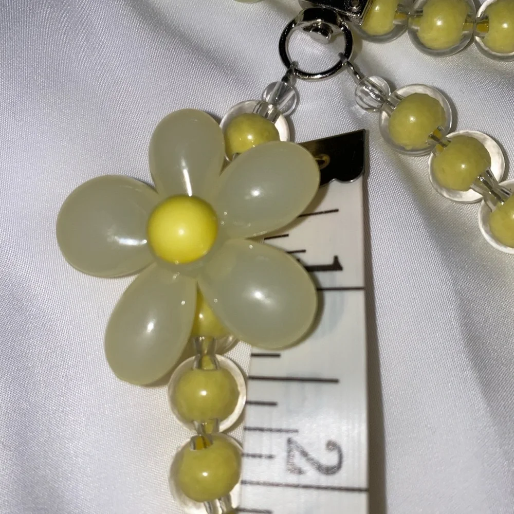 1-wrist lanyard for cells, keys and more Yellow Oversized Flower Charm